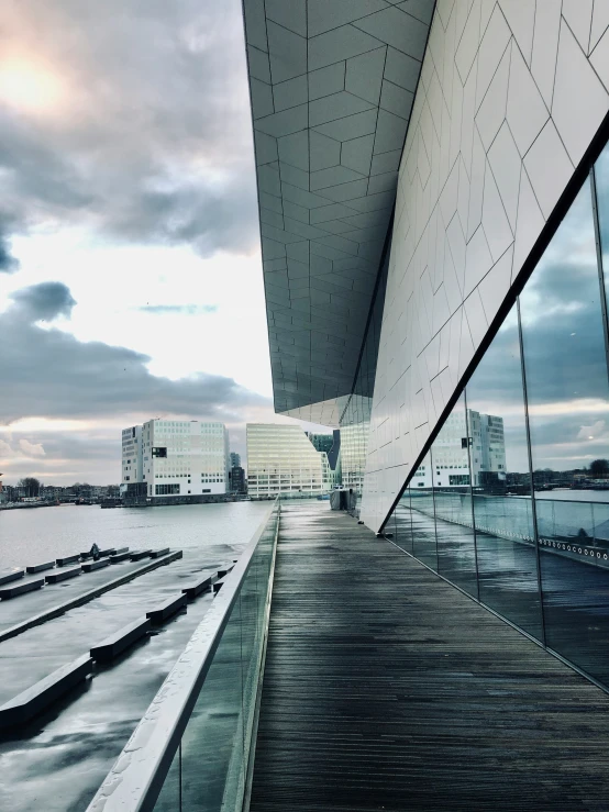 a picture of the exterior of a building with a view of the water