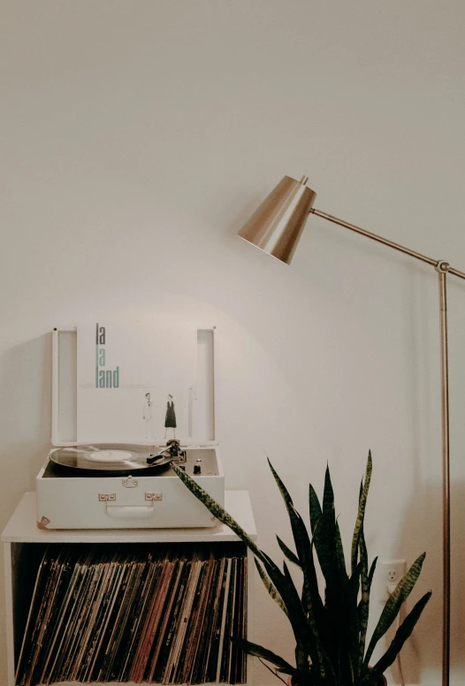 a record player and record tray on a desk