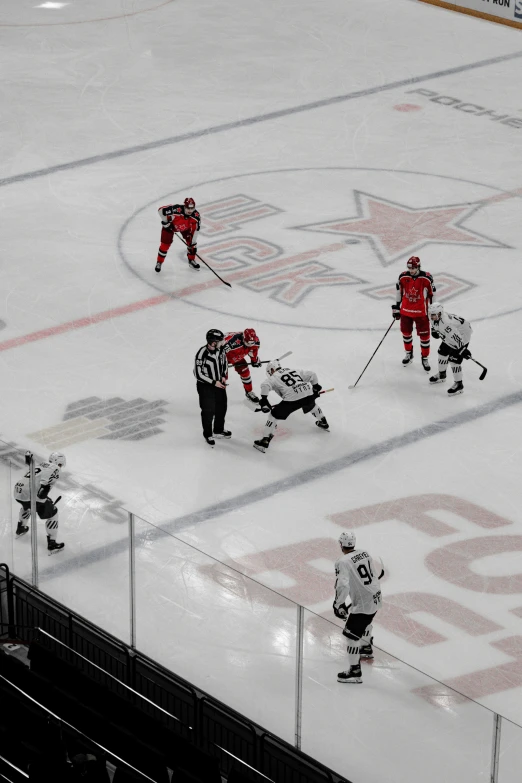 a hockey game being played at an ice rink