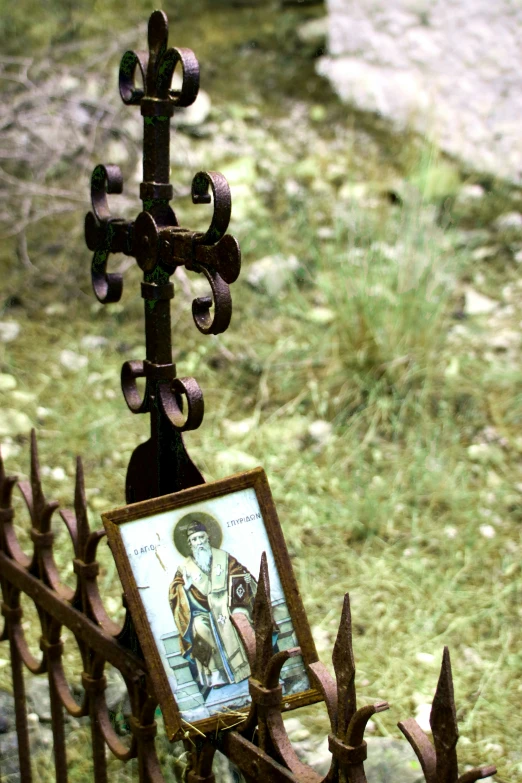 a fence has a picture frame with an image on it