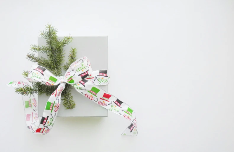 the wrapping paper is tied to the wrapped gift box