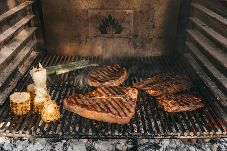 steaks on the grill cooking on the griddle