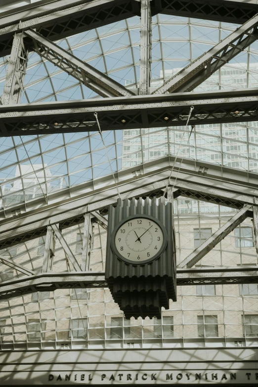 a large clock is seen in the middle of the building