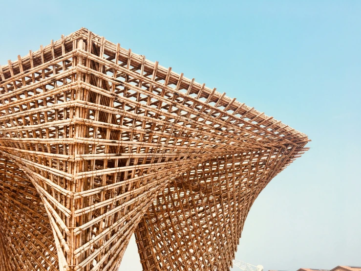 a group of wooden structures with a sky background