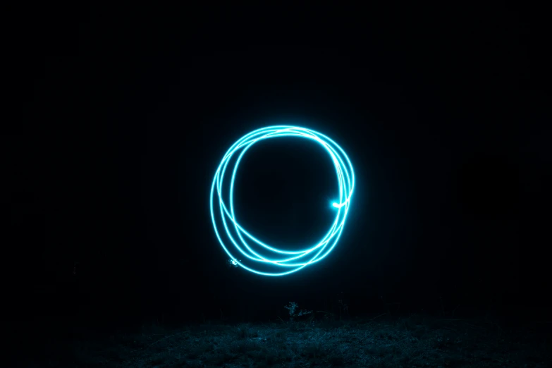 a light painting picture in the dark with circular light