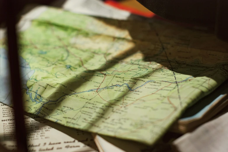 a map laying on top of a book