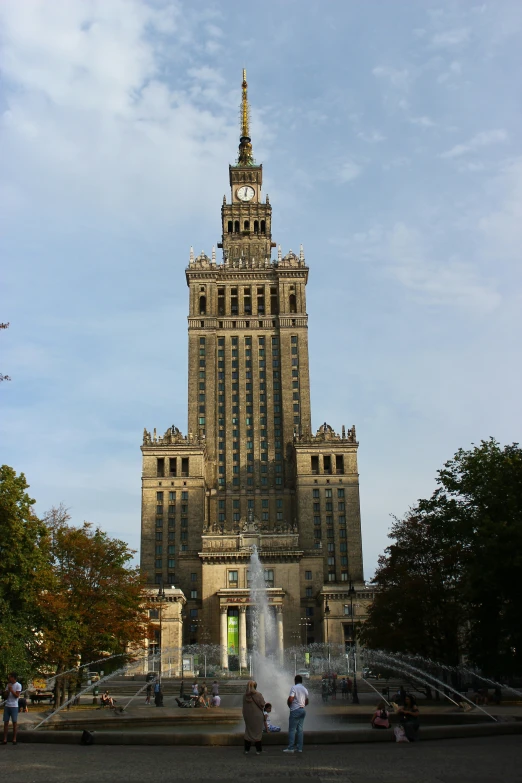 two people look up at a very tall building