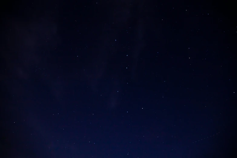 some stars and the sky are almost dark blue