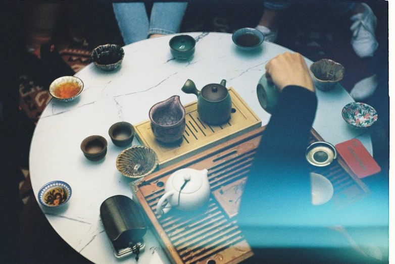 various plates and bowls on an old radio with a person