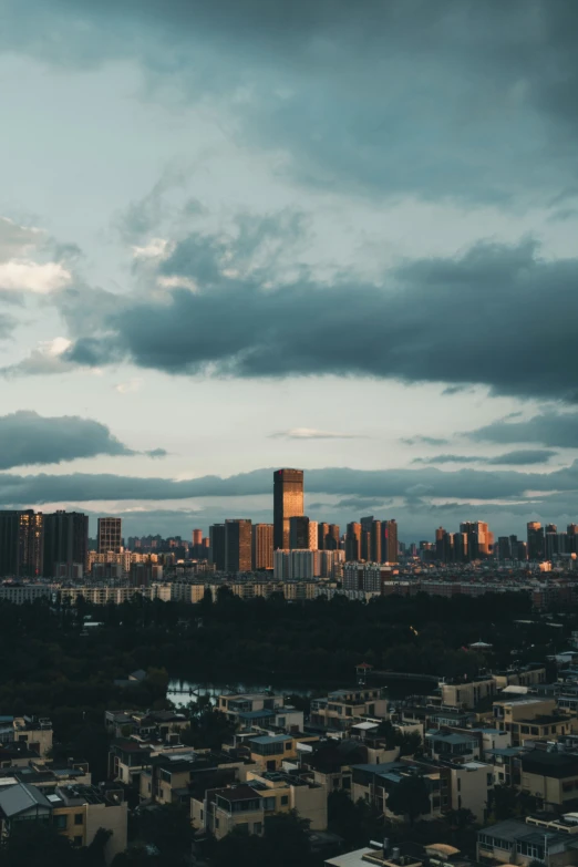 an overcast sky is lit up a city