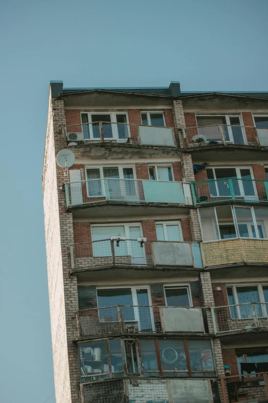 a bunch of balconies attached to the side of an old building