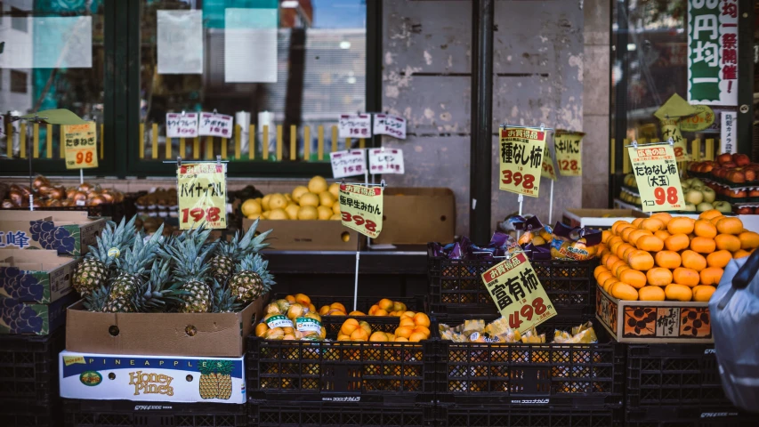 a couple of fruit is for sale in a market