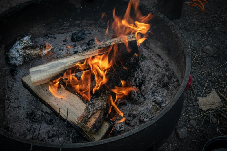 a large fire pit that is open to expose some fire