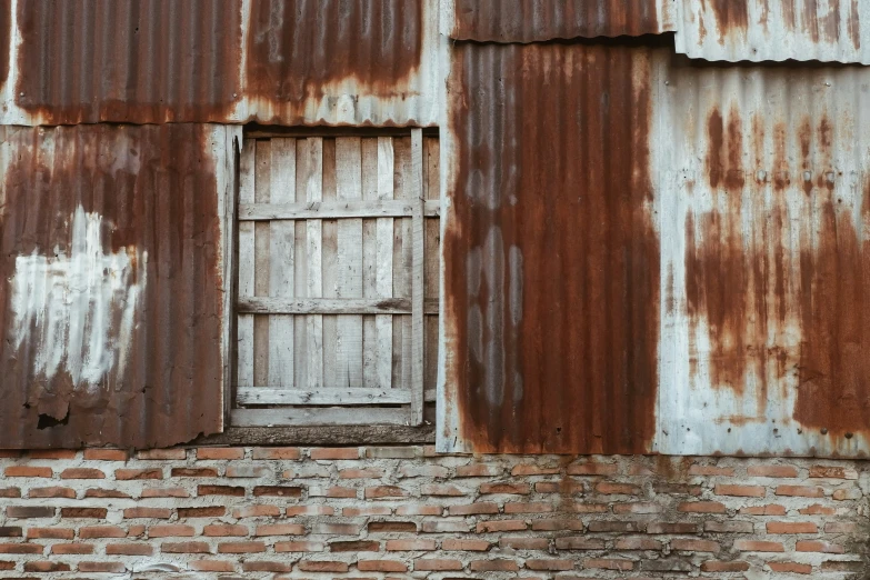 an old brick wall and door made of wooden