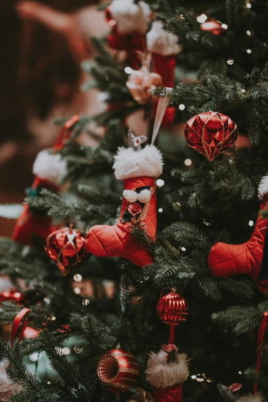 a christmas tree with ornaments and a small tree