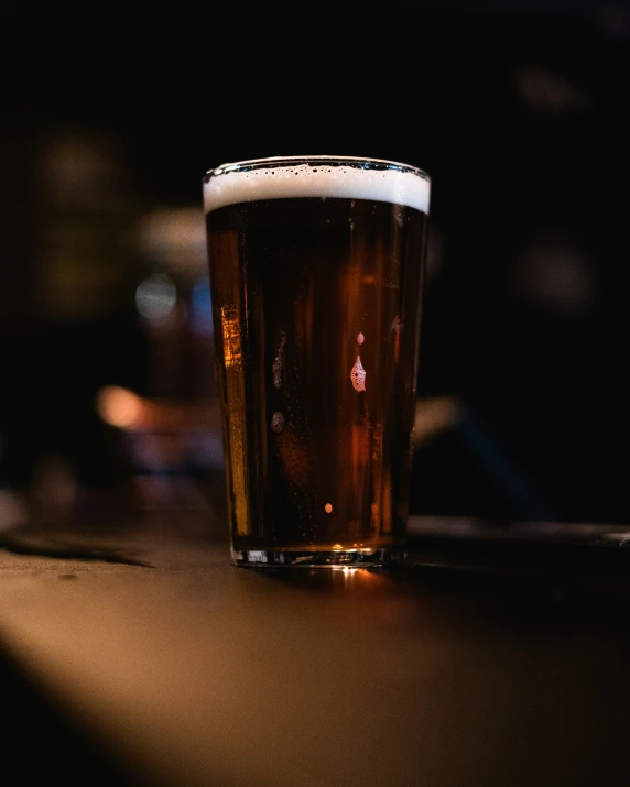 close up of a glass with soing brown in it