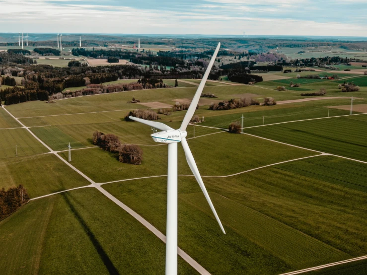 a wind turbine is shown in an aerial view