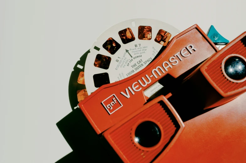 an orange object with a white clock behind it