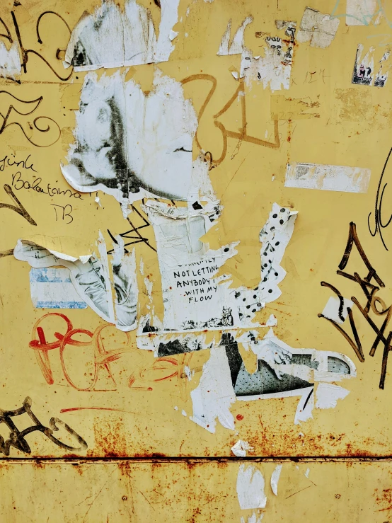 there is a large old wall with graffiti on it