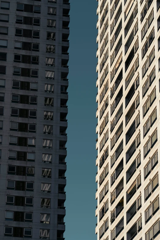 a tall building with many windows in front of it