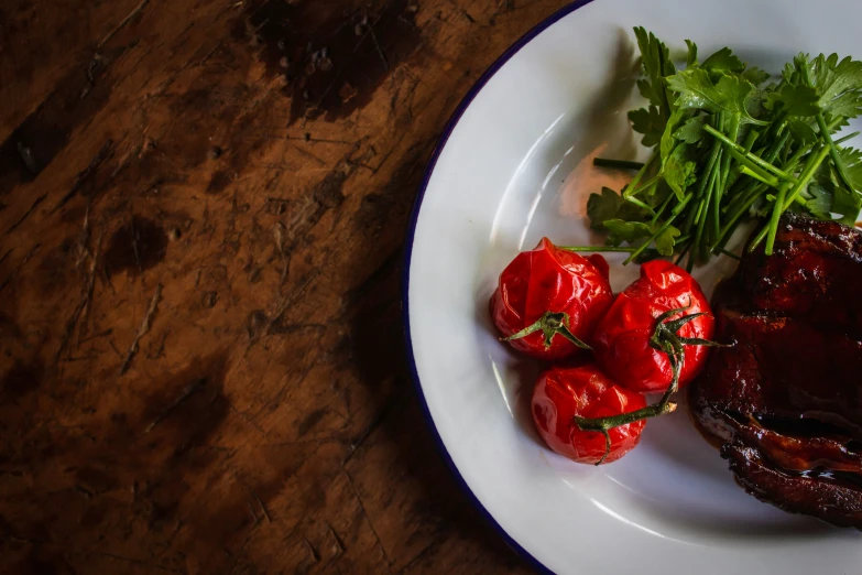 an open faced dinner of meat, green onions and tomatoes