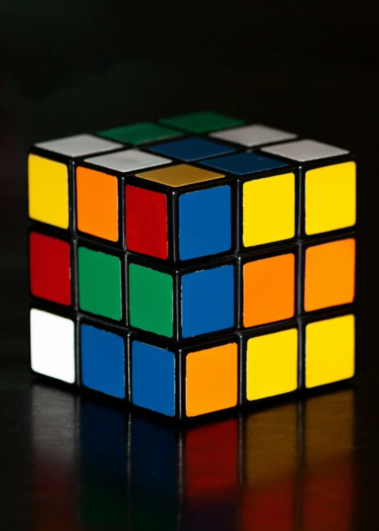 an empty rubikbe on a table with black background