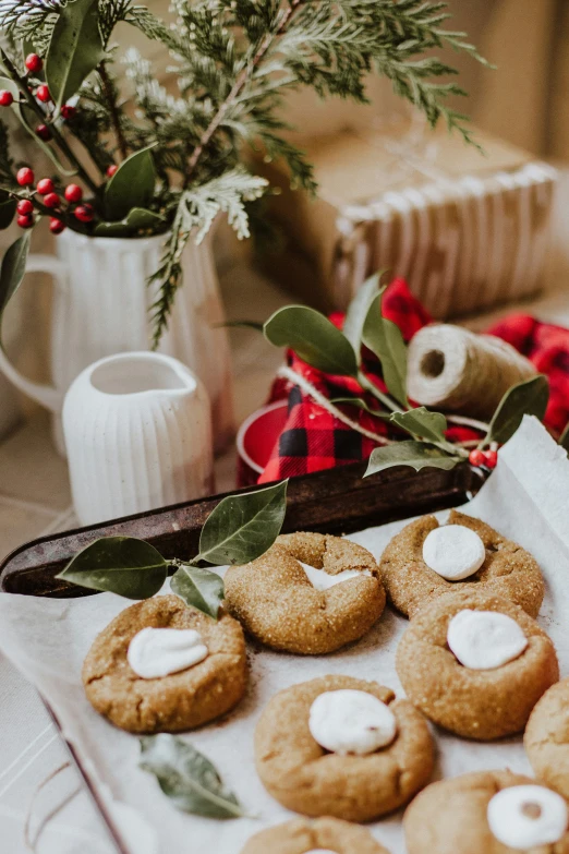 a cookie on a baking sheet with other cookies and candy on a tray