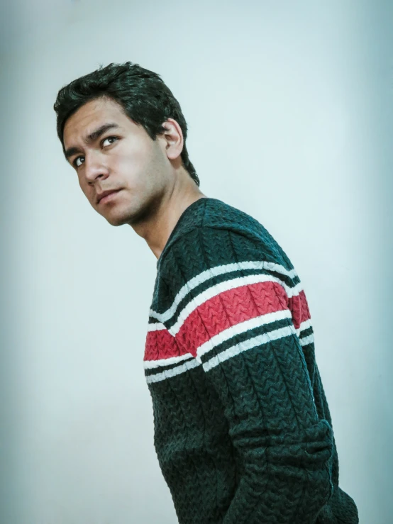 a person with a sweater over his shoulder