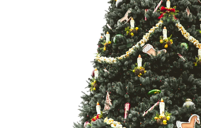 a christmas tree with white and gold decorations