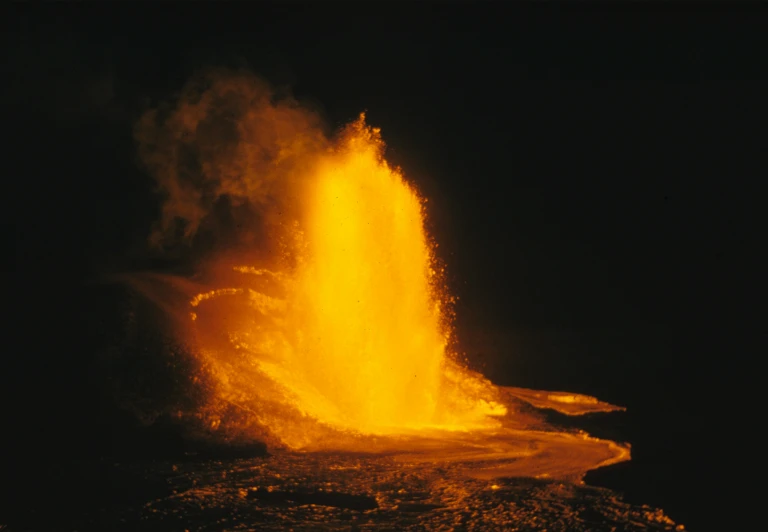 bright yellow colored substance erupts out from an ocean