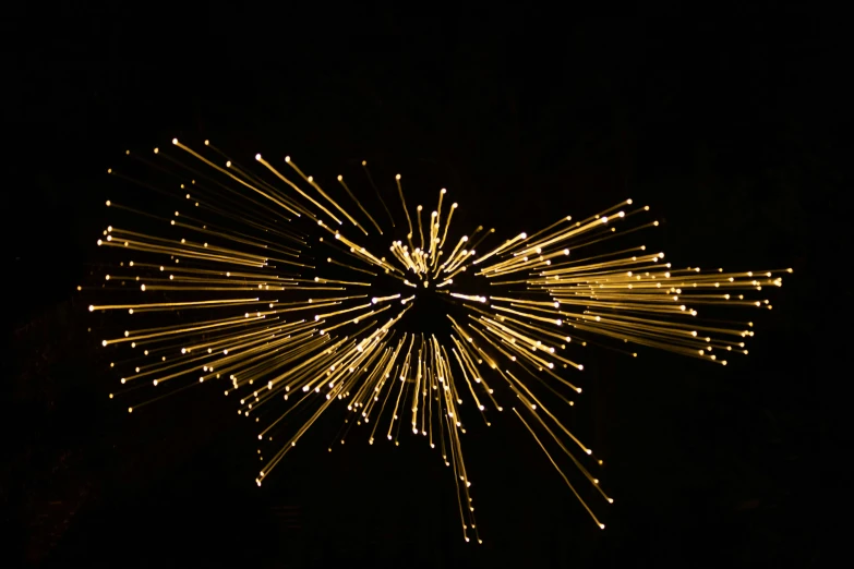 fireworks are bursting as seen in the night sky