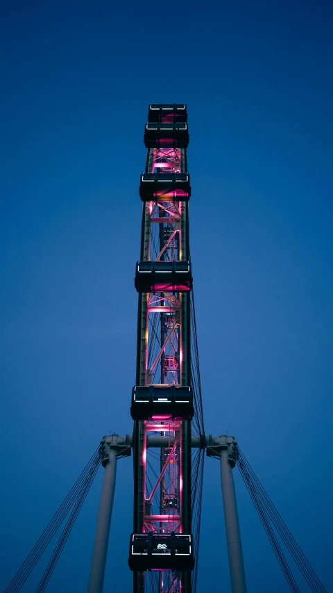 the tower lights up the night sky on the bridge