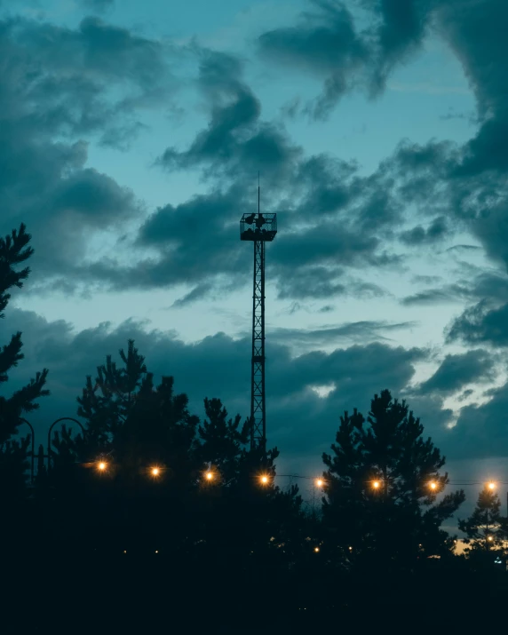 a night scene with some buildings and trees