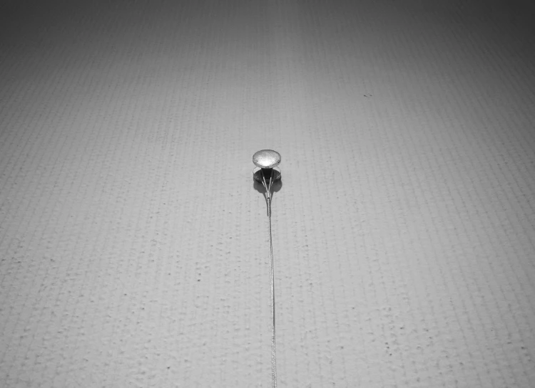 a black and white po of a clock and water dripping