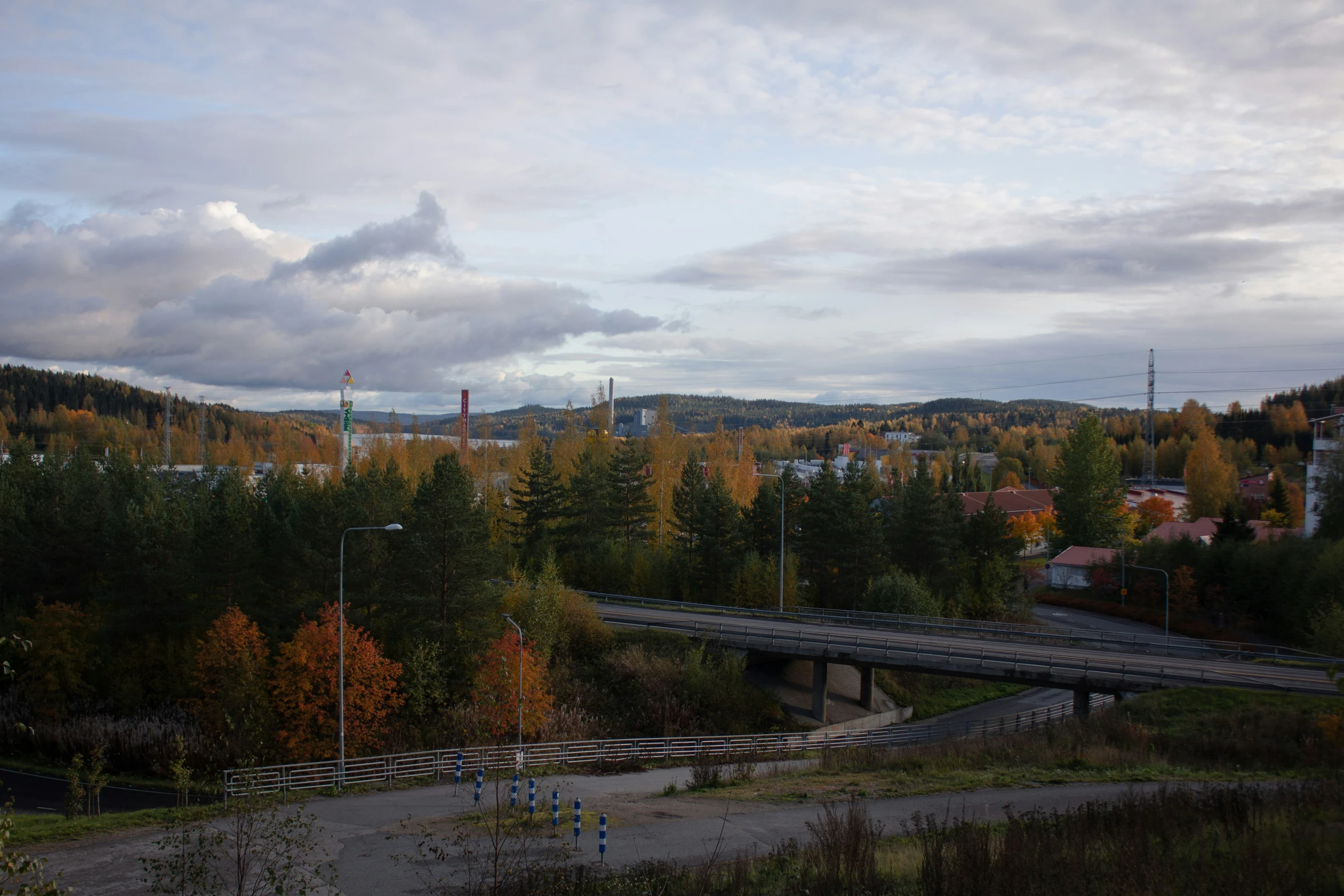 a highway with trees and sky in the background