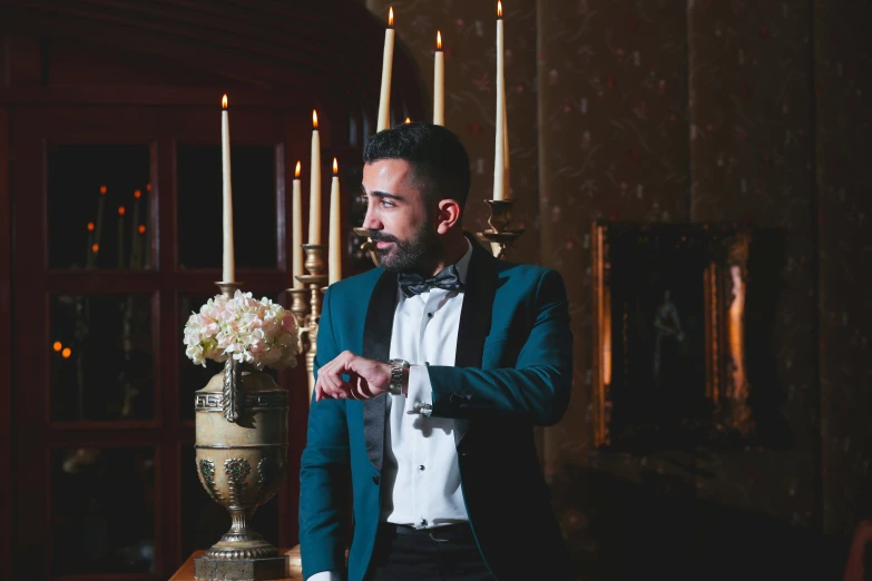 man in formal attire preparing to put on a bow tie