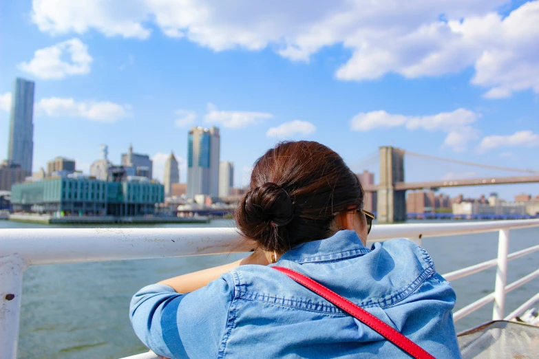 the woman is looking out at the city