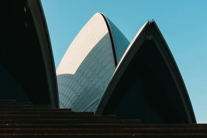 an image of a tall building with many stairs going up it