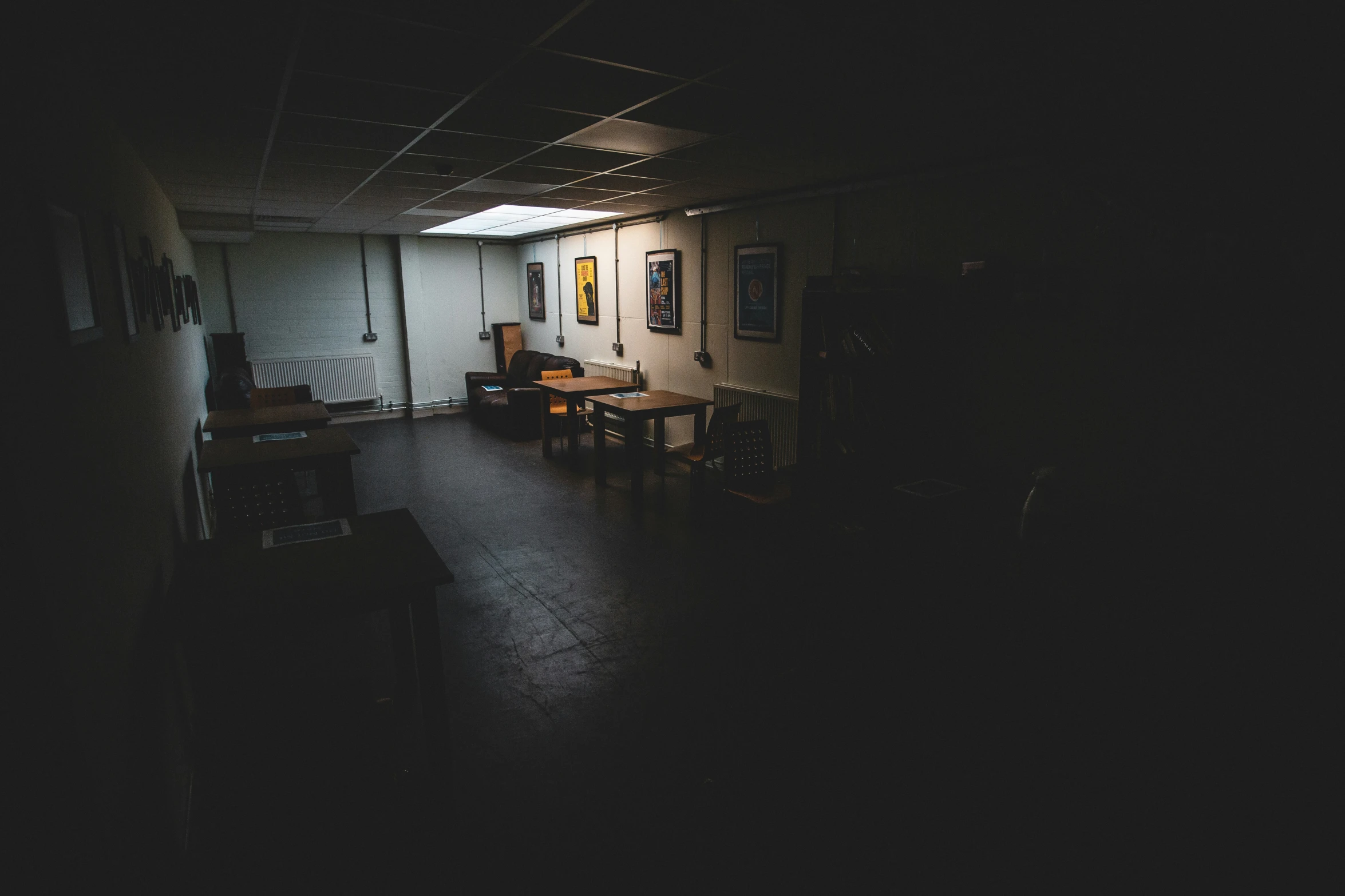 a dimly lit room with furniture and decorations