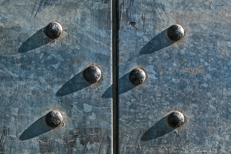 a close up image of a door with screw holes