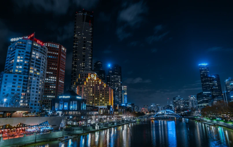 an urban area illuminated in brightly lights at night