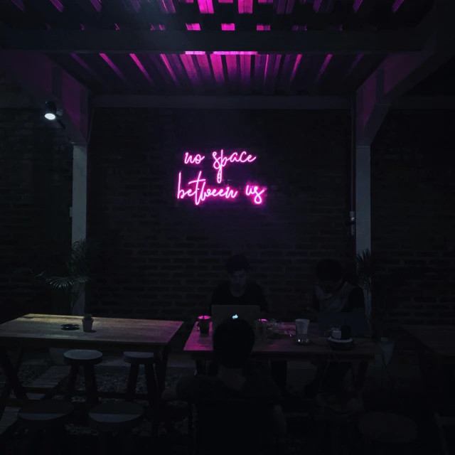 an illuminated neon sign in a room