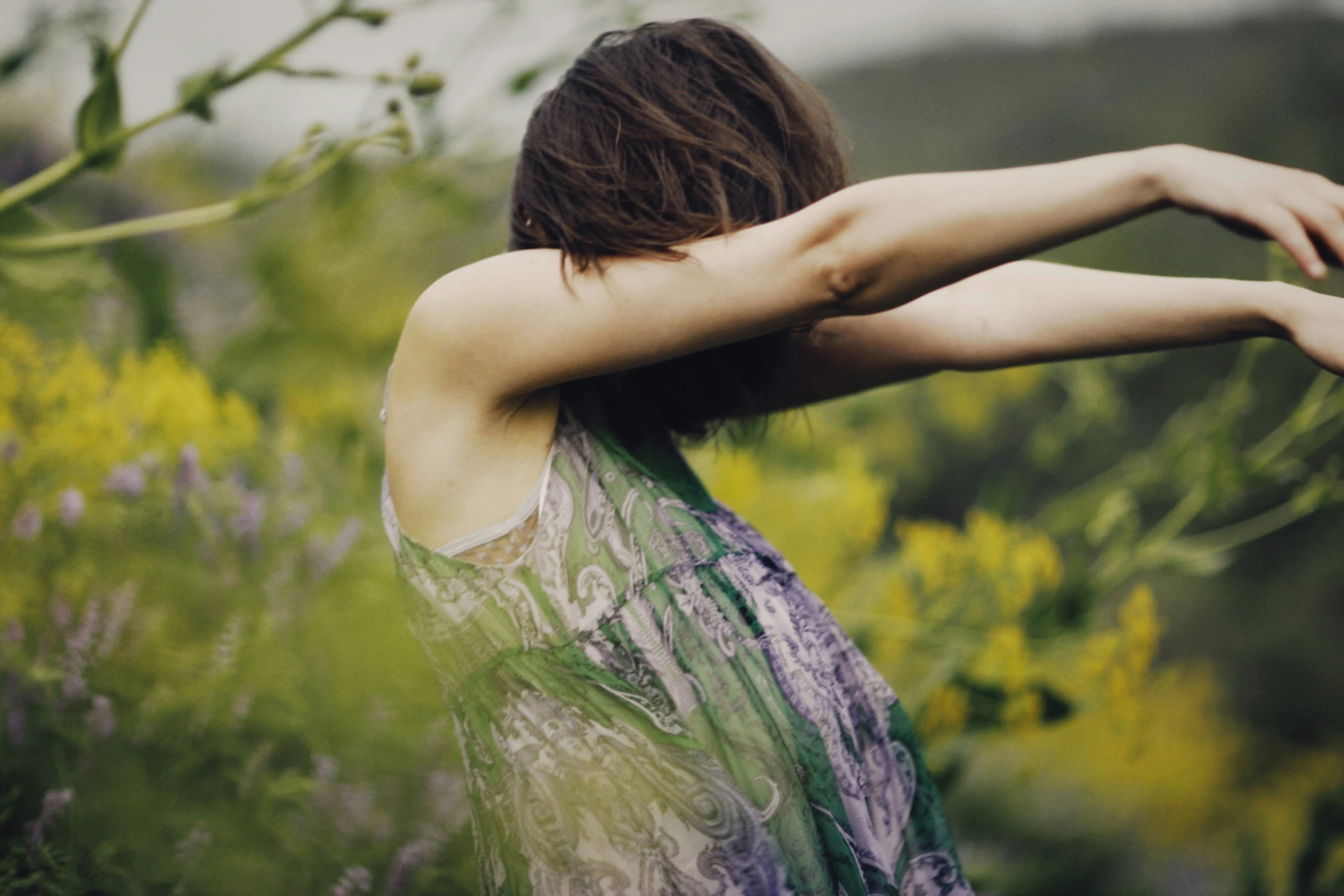 an image of a woman with arms extended