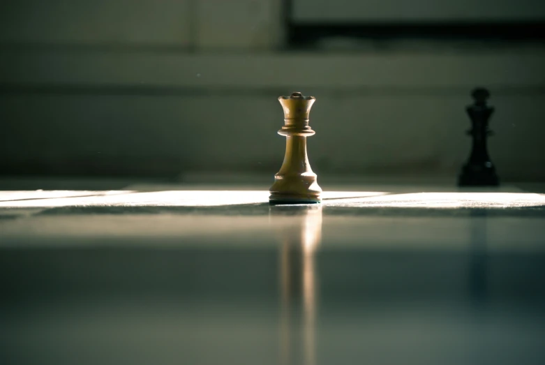 a small white chess piece on the floor