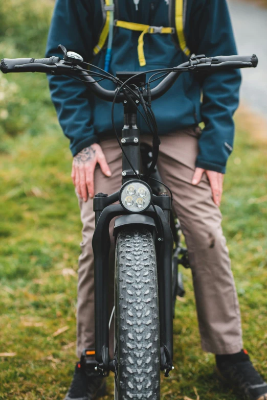 a person that is sitting on a bike