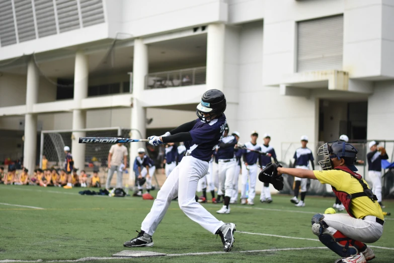 a batter hitting a ball with his bat in the air