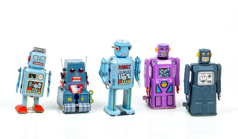 five robots standing together in an array