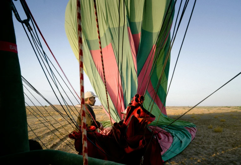 an indian woman is riding in a colorful kite