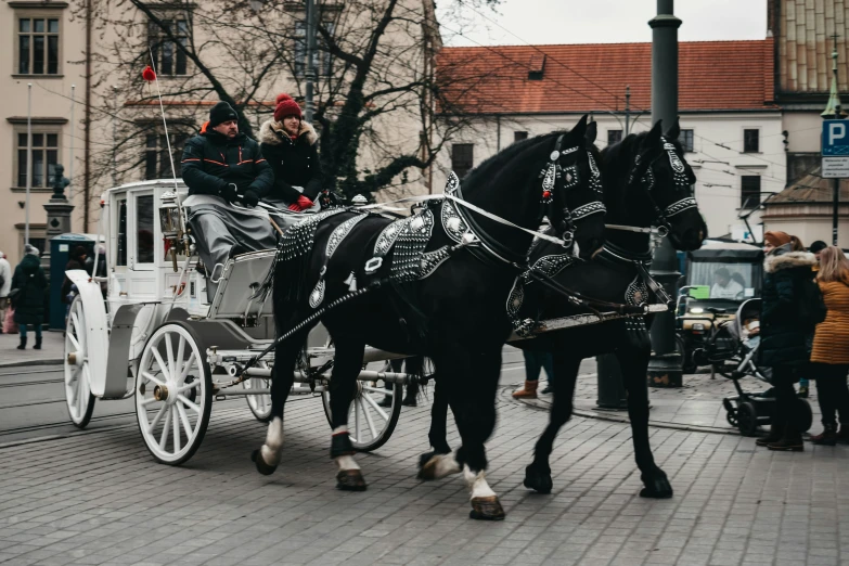 some people sitting on top of a carriage