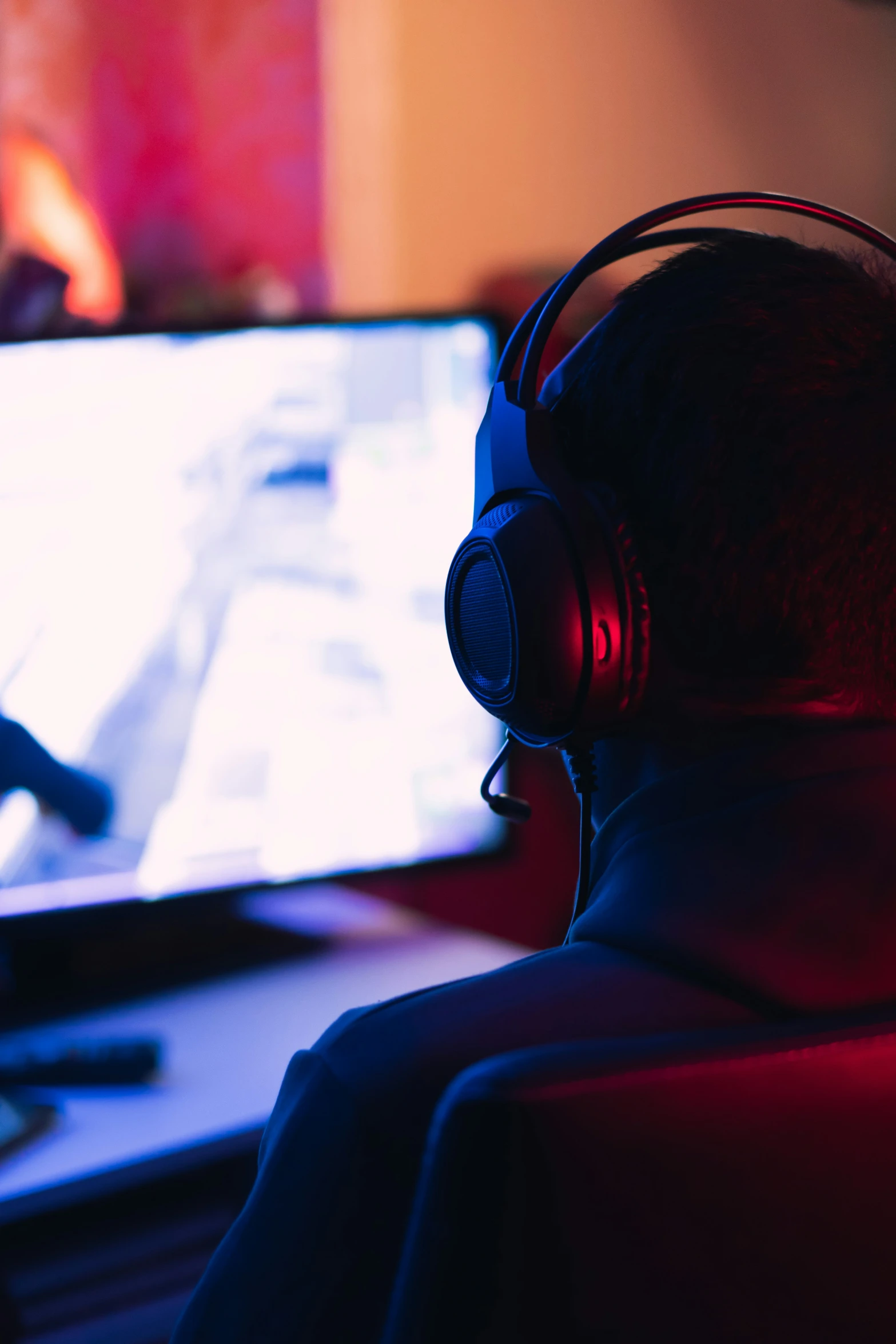 headphones are the focal point of this pograph of the man wearing black